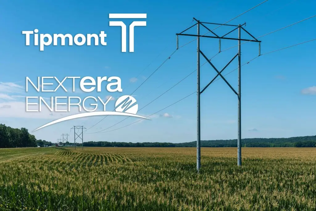 Power lines across a farm field with the Tipmont and NextEra logos at the upper left
